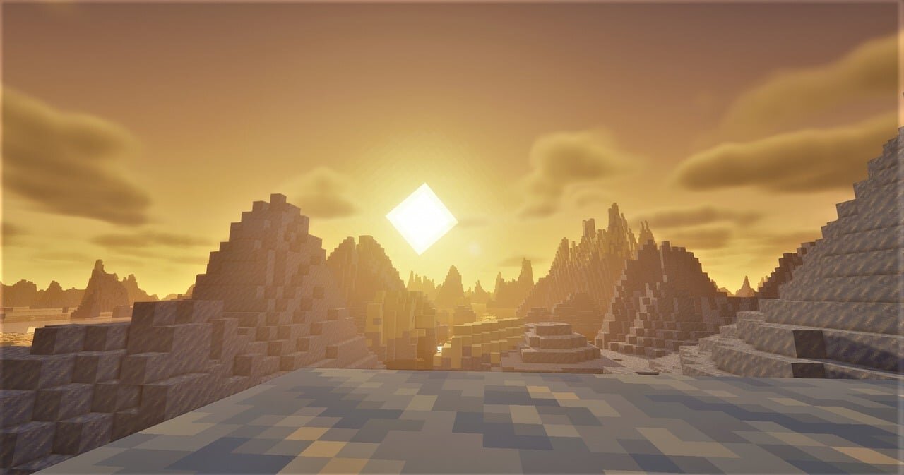 A dramatic Minecraft sunset over jagged mountain peaks, rendered with shaders