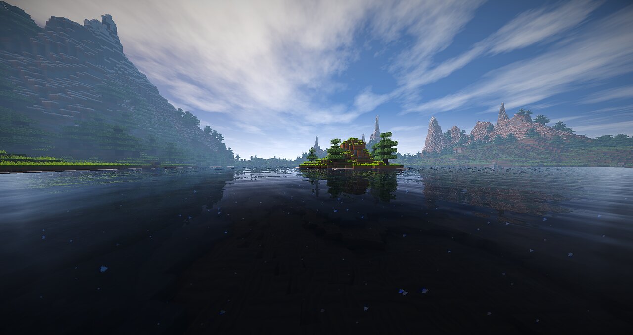 A misty Minecraft lake framed by mountains at dawn