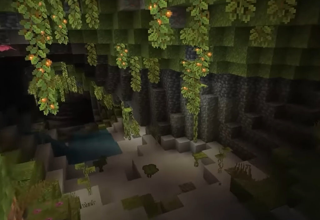 A lush cave biome in Minecraft, full of greenery and dripstone