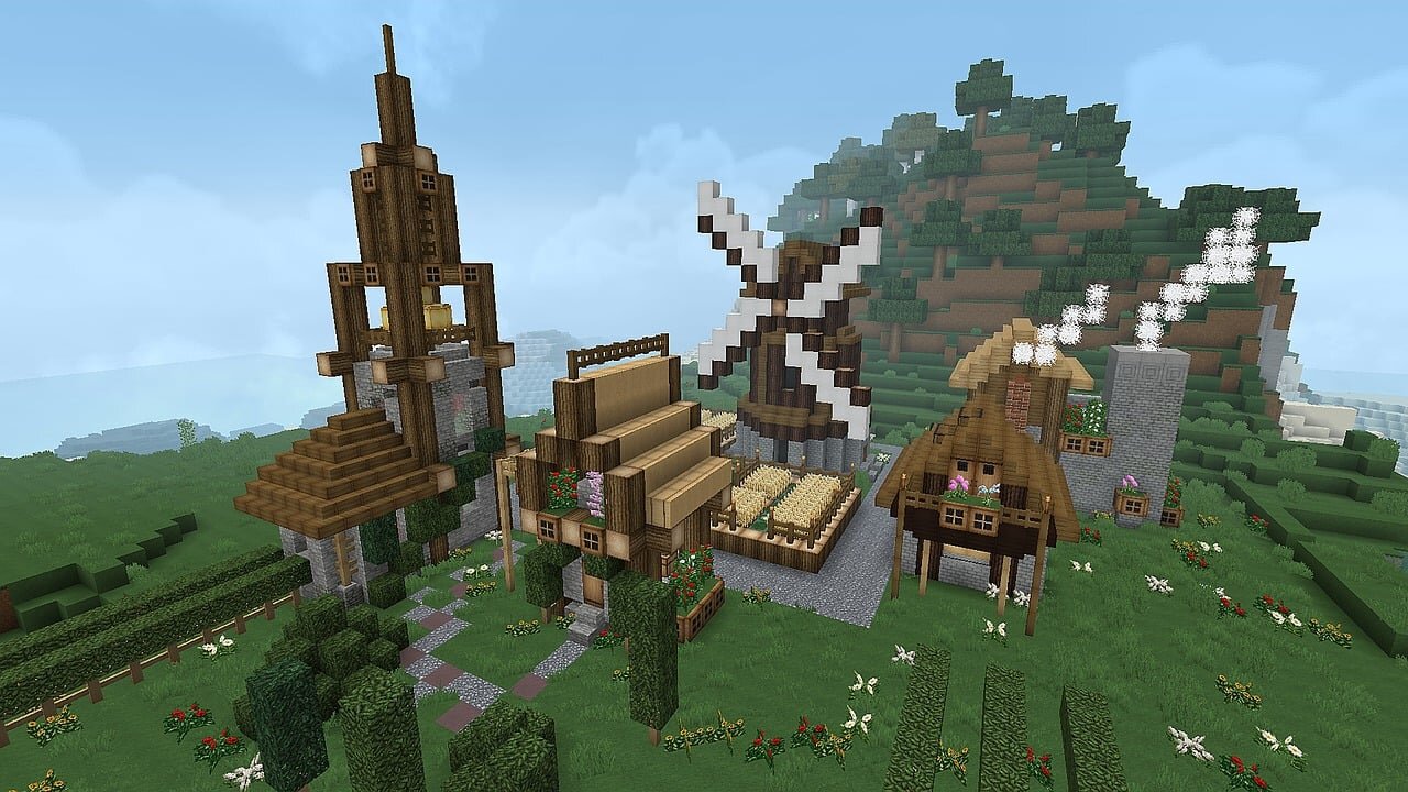 A cozy Minecraft village build with a windmill and stone paths