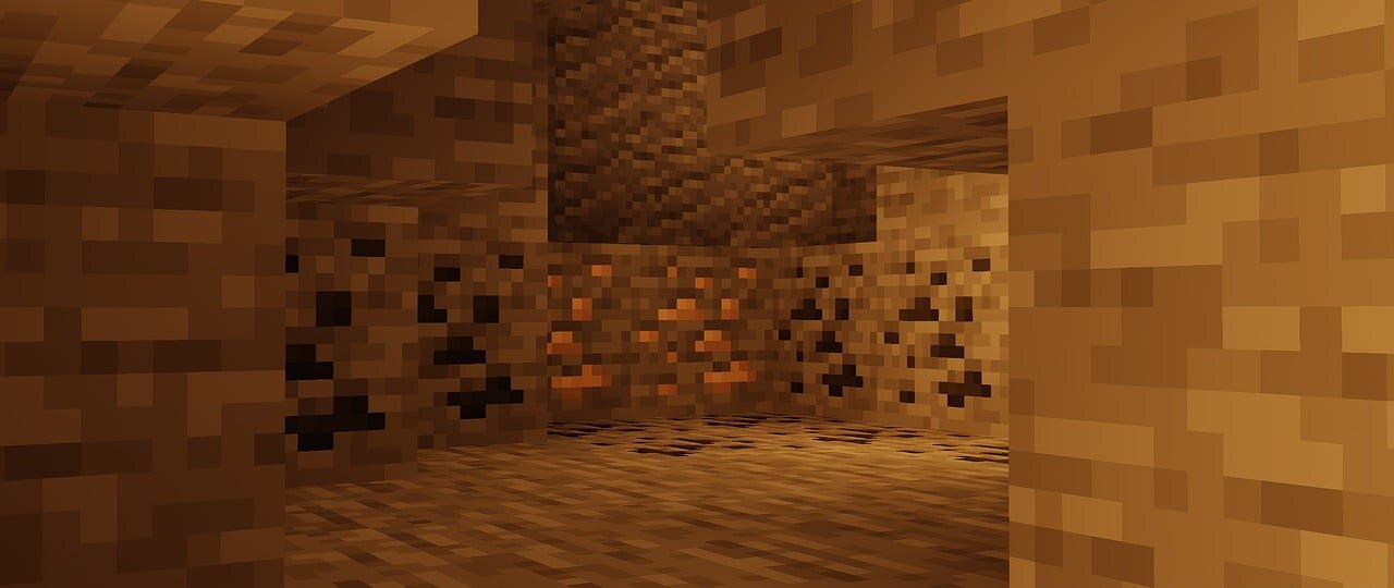 An underground Minecraft mineshaft with glowing copper ore veins