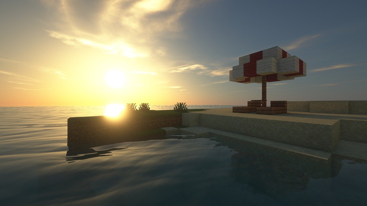 A calm Minecraft beach at sunset with a parasol on the shore